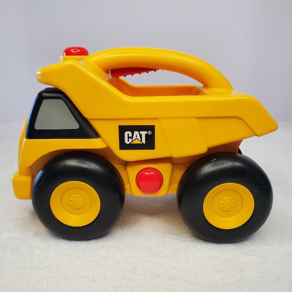 Caterpillar Dump Truck Flashlight Lights Sounds Rolls Toy Construction Vehicle